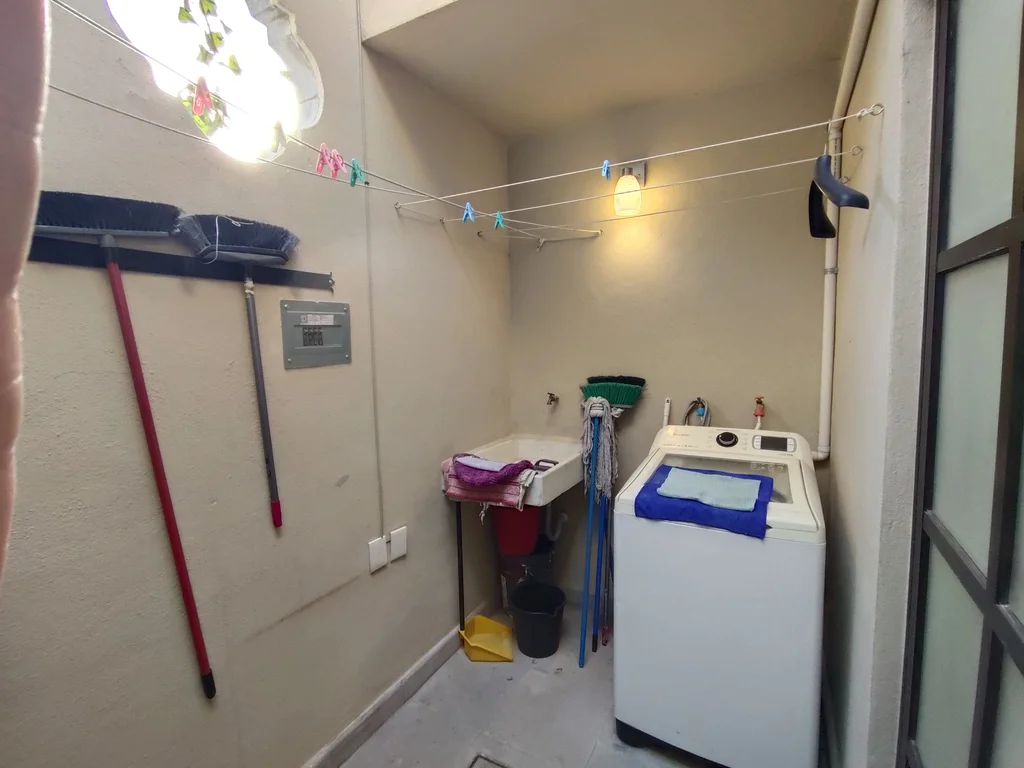 Dedicated laundry room with washing machine